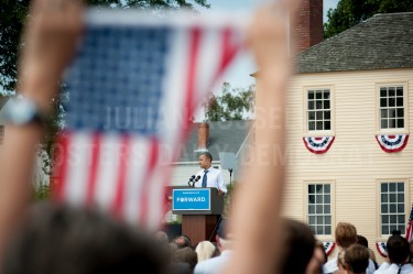 Framed by an american flag President Barack Obama speaks from the podium during a campaign rally at Strawberry Banke in Portsmouth on Friday.