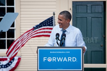 President Barack Obama speaks from the podium during a campaign rally at Strawberry Banke in Portsmouth on Friday.