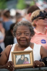 Vernis Jackson of Portsmouth holds a photo of her and Michelle Obama at a campaign rally for president Barack Obama held at Strawberry Banke in Portsmouth on Friday.