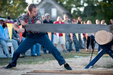 The Paul Bunyan Lumberjack Show performs with a cross saw at the Rochester Fair on Sunday.